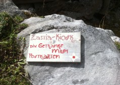 A sign of Zastia Kiosk on the rock